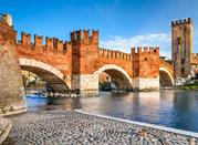 Verona, Italy. Scenery with Adige River and Ponte Scaligero and Castelvecchio, medieval landmarks of veronese city.