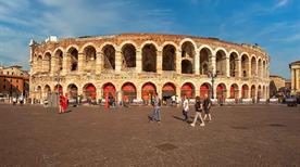 View to Verona Arena (Arena di Verona), popular tourist attraction, people walking by