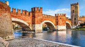 Verona, Italy. Scenery with Adige River and Ponte Scaligero and Castelvecchio, medieval landmarks of veronese city.